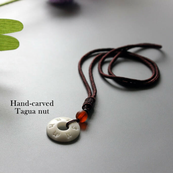 HANDMADE NECKLACE IN TAGUA NUT PENDANT WITH OM MANTRA SIGN