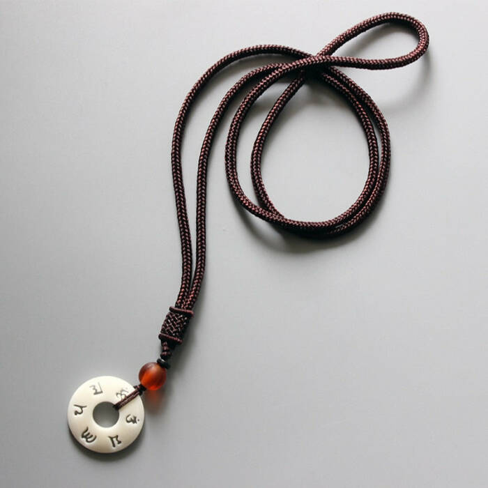 HANDMADE NECKLACE IN TAGUA NUT PENDANT WITH OM MANTRA SIGN